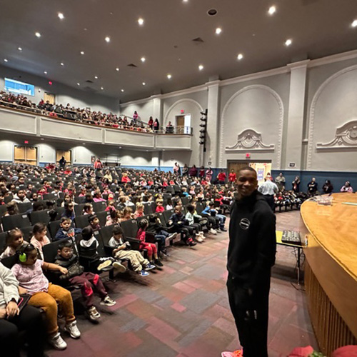 Noel stands in a packed auditorium at Paxinosa Elementary School in Easton, PA