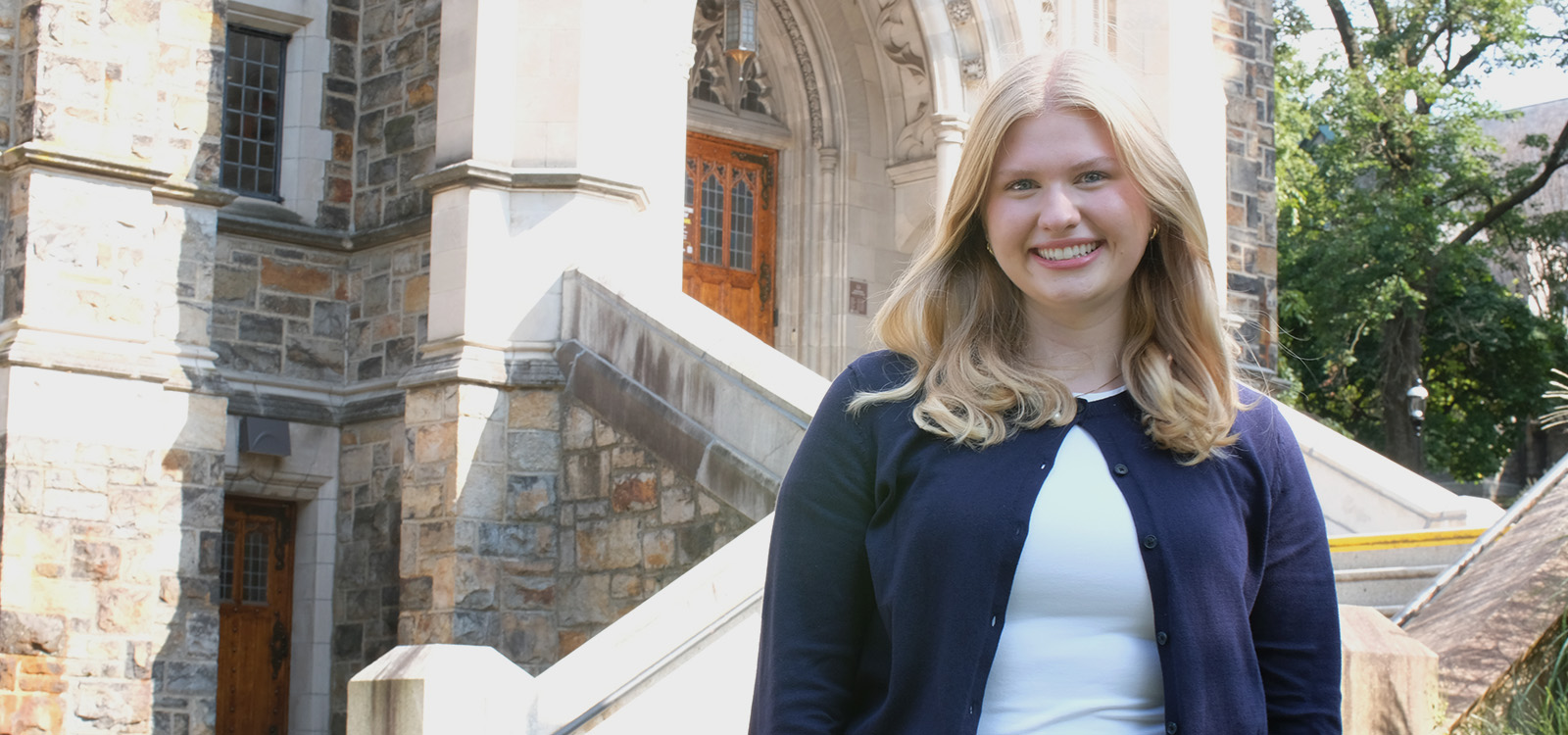 Annika Lilja stands on the steps outside Linderman Library