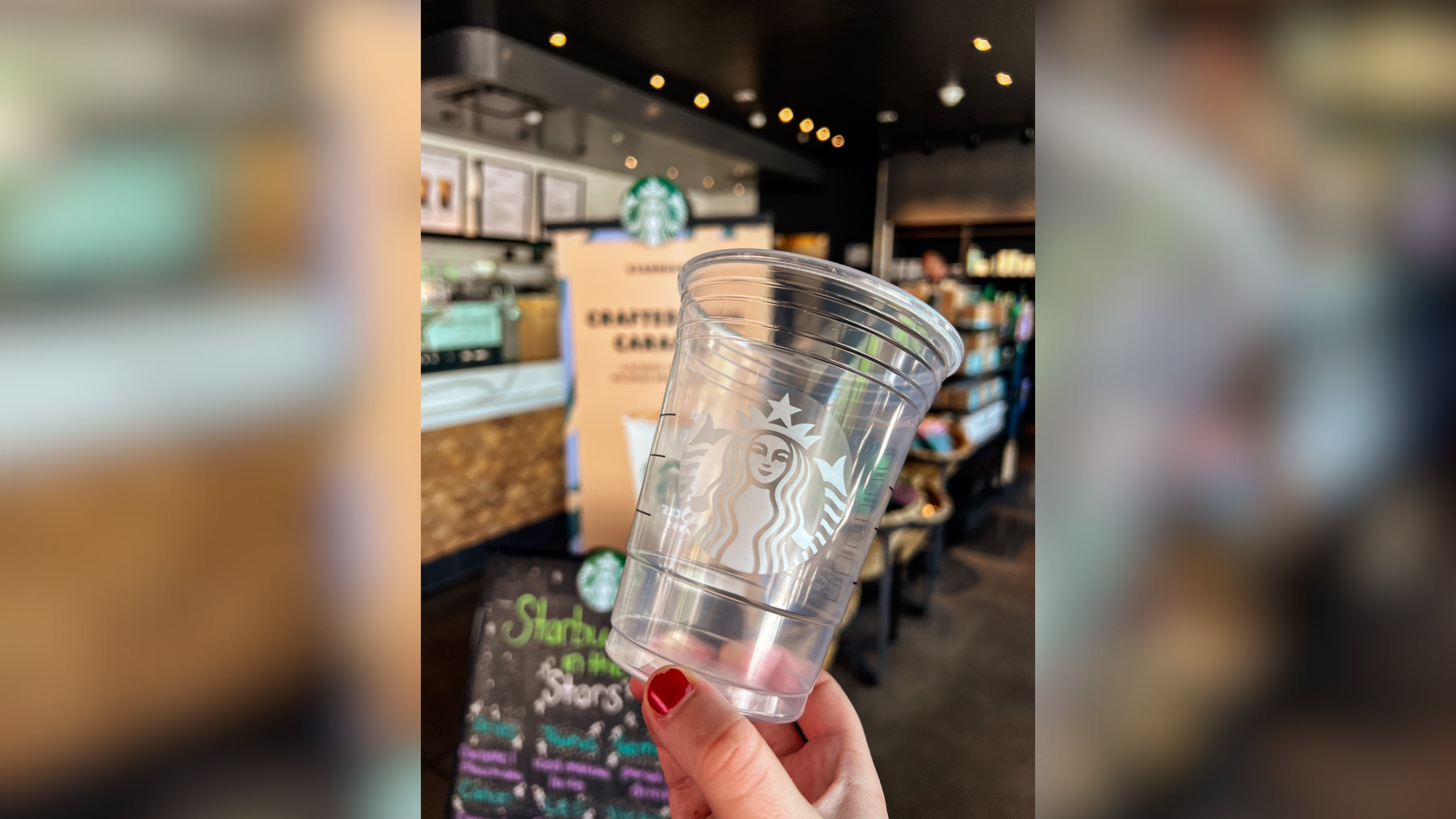 Close up of a plastic Starbucks cup being held inside of a Bethlehem, PA Starbucks