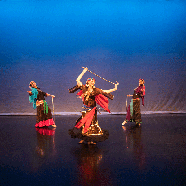 Three women dancing on stage