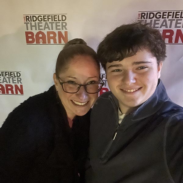 Jen with her son at theater event