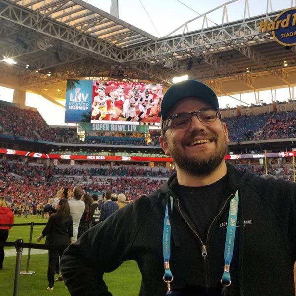 Lucas Ingram takes a selfie on the field at the Super Bowl
