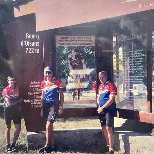 Richard stands with other riders in France