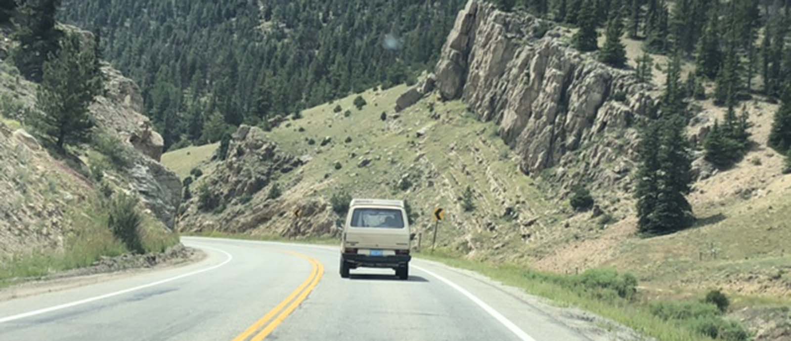 VW bus in a mountain pass