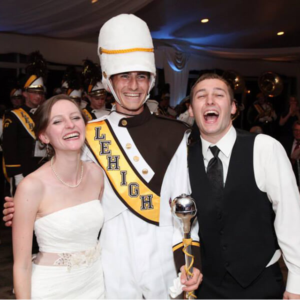 Julia and Josh Westbrook with Marching 97 drum major