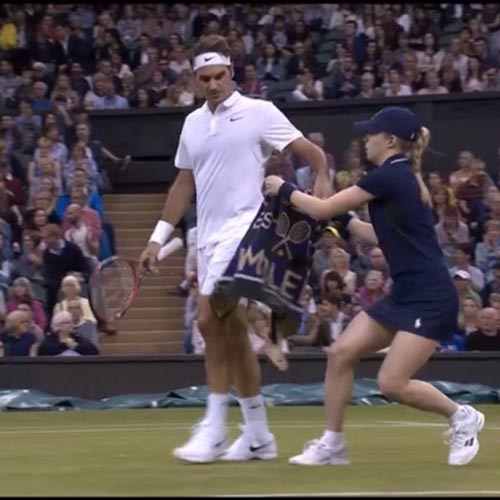 Eliza brings towel to Roger Federer