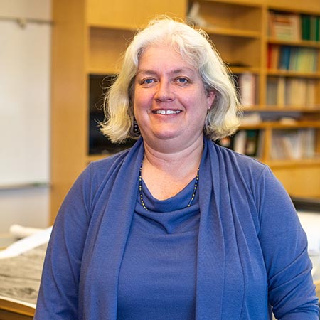 Joan Ramage Macdonald stands in her lab