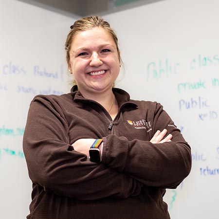 Kallie Ziltz in front of a whiteboard