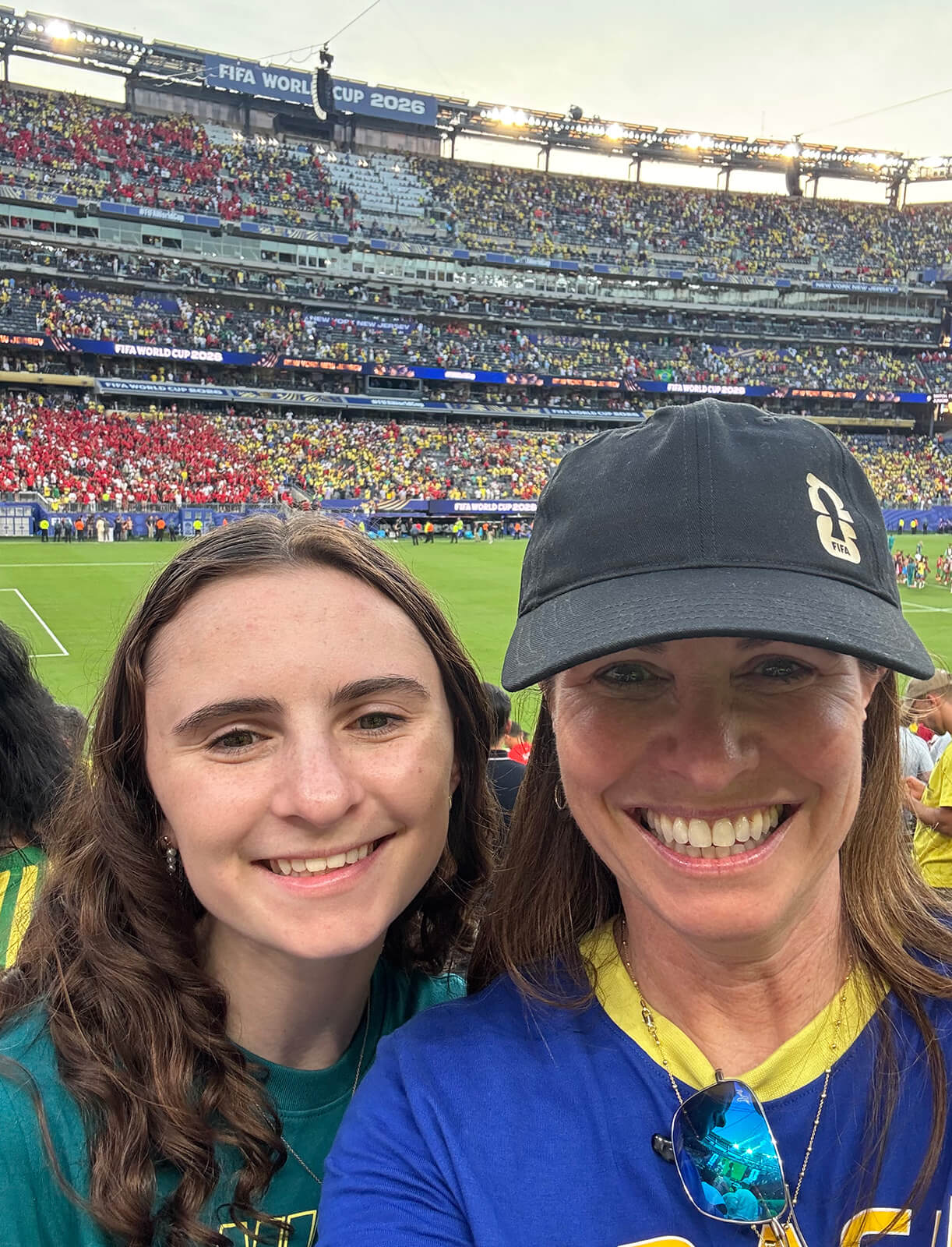 Donna Providenti ’93 stands with her daughter Abby before a soccer match during the 2026 FIFA World Cup.