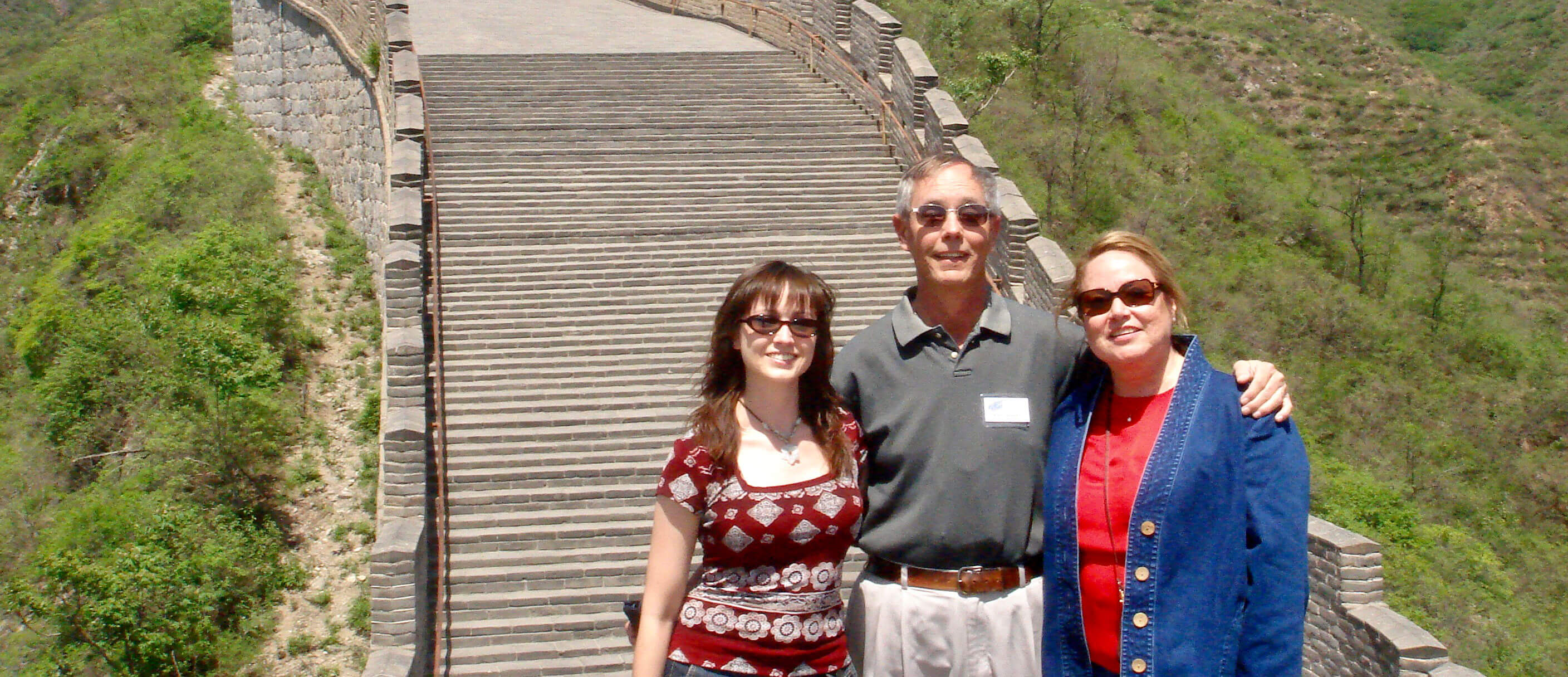 Victoria, Michael, and Norma Jean Jaggard stand on the Great Wall of China.