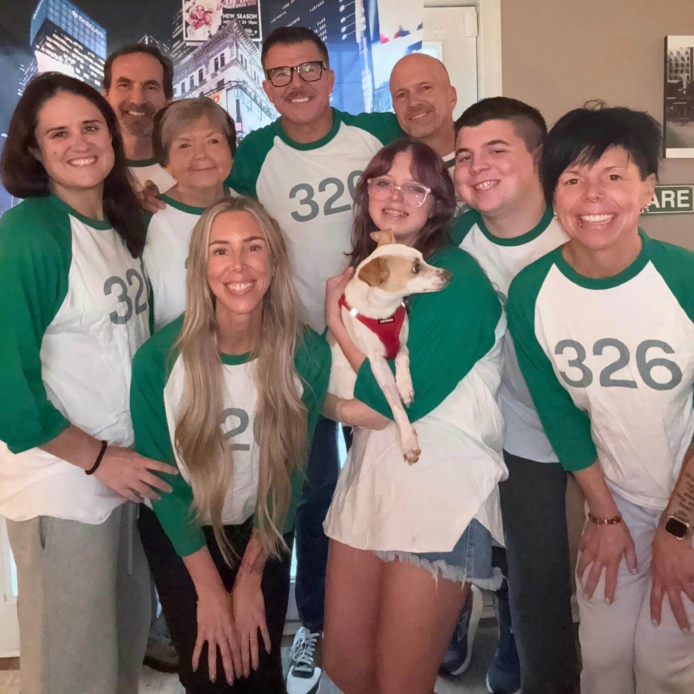 Anhorn and his friends group together and wear matching white and green shirts with 326 on the front of them.