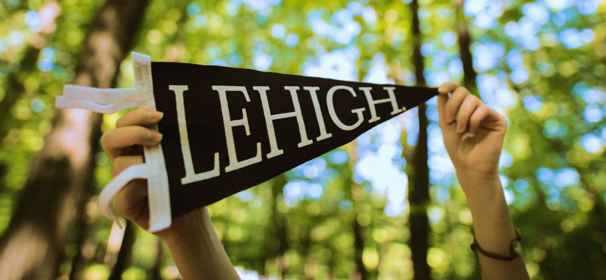 Brown Lehigh Pennant held by two hands