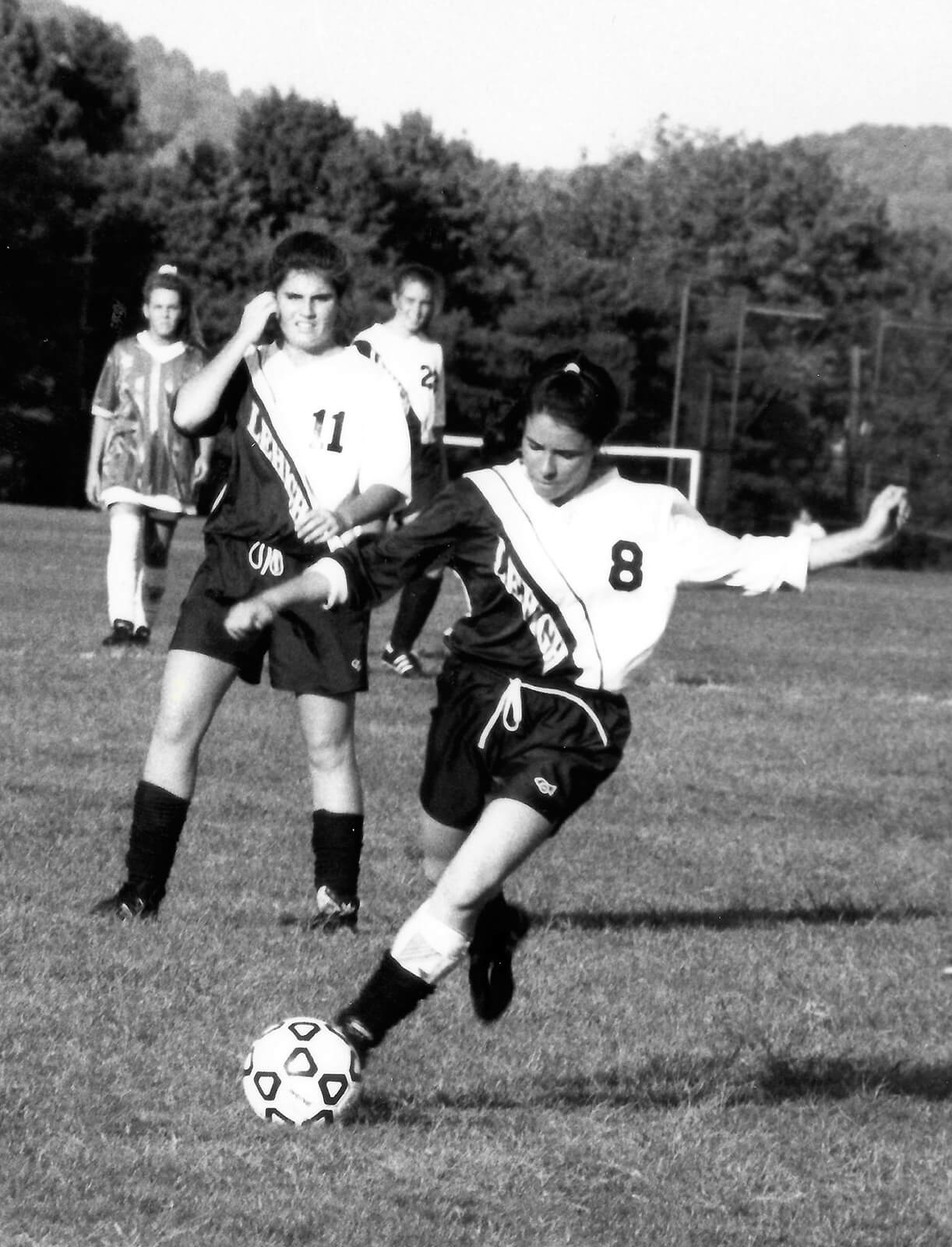 Donna Providenti ’93 kicks a soccer ball.