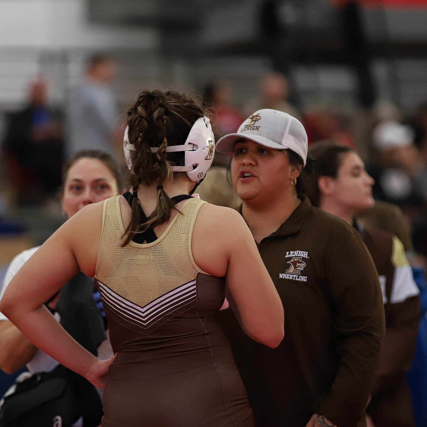 Lehigh Women’s Wrestling Head Coach Brazel Marquez speaks with one of her student-athletes