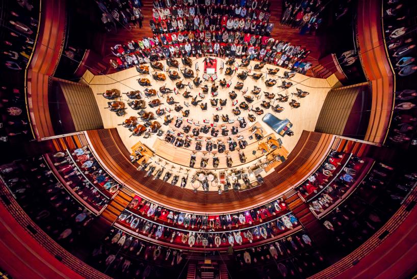 Philadelphia Orchestra on stage performing as seen from above