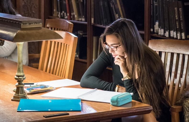 Student sitting at a table studying