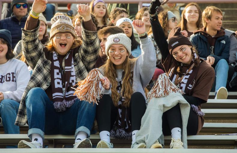 Students wearing Lehigh gear and cheering on their team