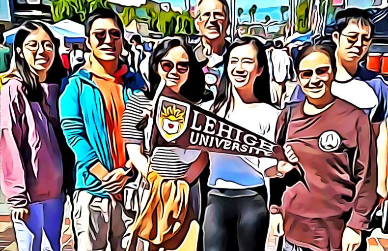 LAAN members gathered for a group photo waving a Lehigh pennant.