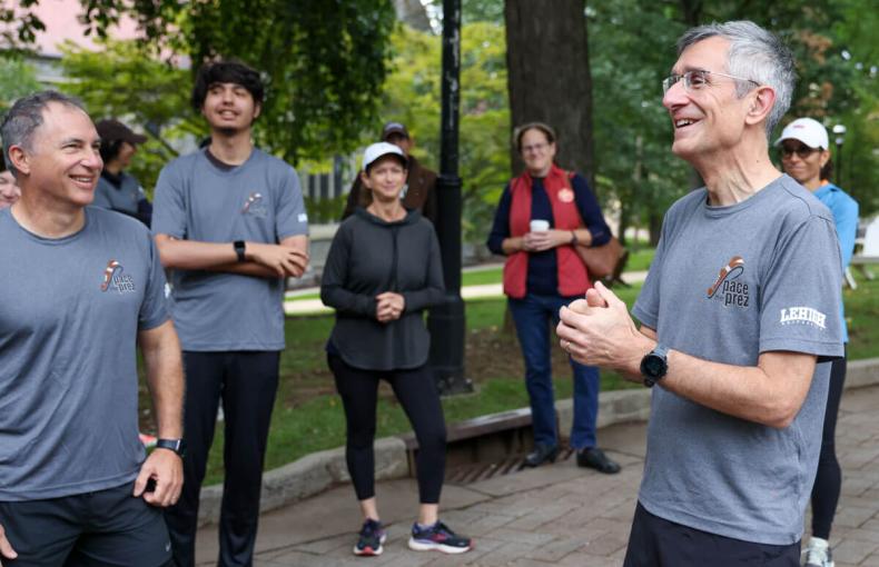 Lehigh President Joseph Helble speaks with a few runners during an outdoor Pace the Prez event on Lehigh University's campus.