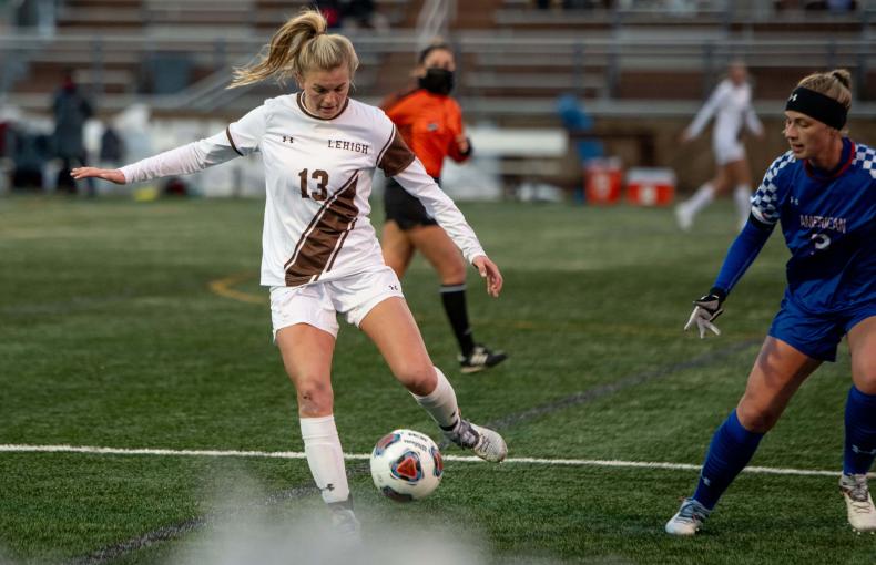 Lehigh Women's Soccer player kicking a soccer ball