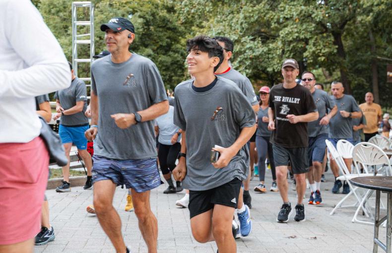 Runners jogging to begin their run.
