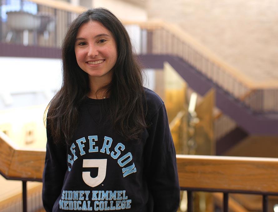 Isabel Lavine shows off her medical school sweatshirt