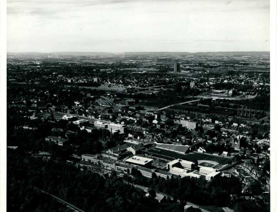 Black and white photo of an aerial shot of South Bethlehem. Lehigh is in the foreground; Martin Tower is in the background.