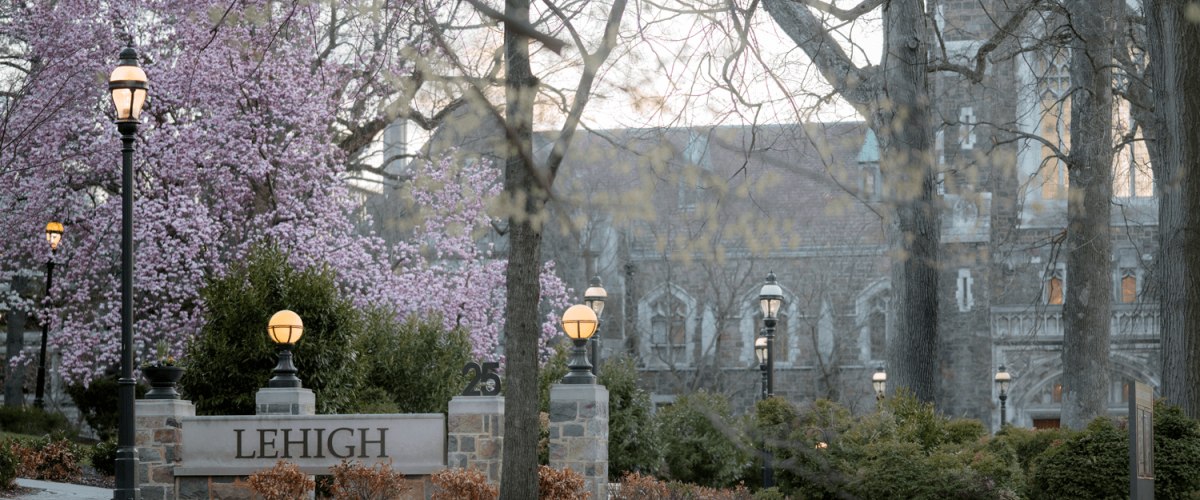 Exterior view behind Lehigh University's Alumni Memorial Building on a spring day