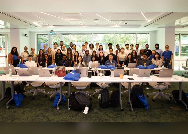 A large group of 2023 summer interns at Visa posing for a group photo