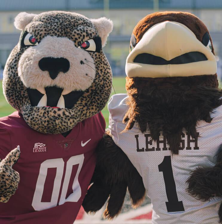 Clutch and the Leopard posed together on the football field