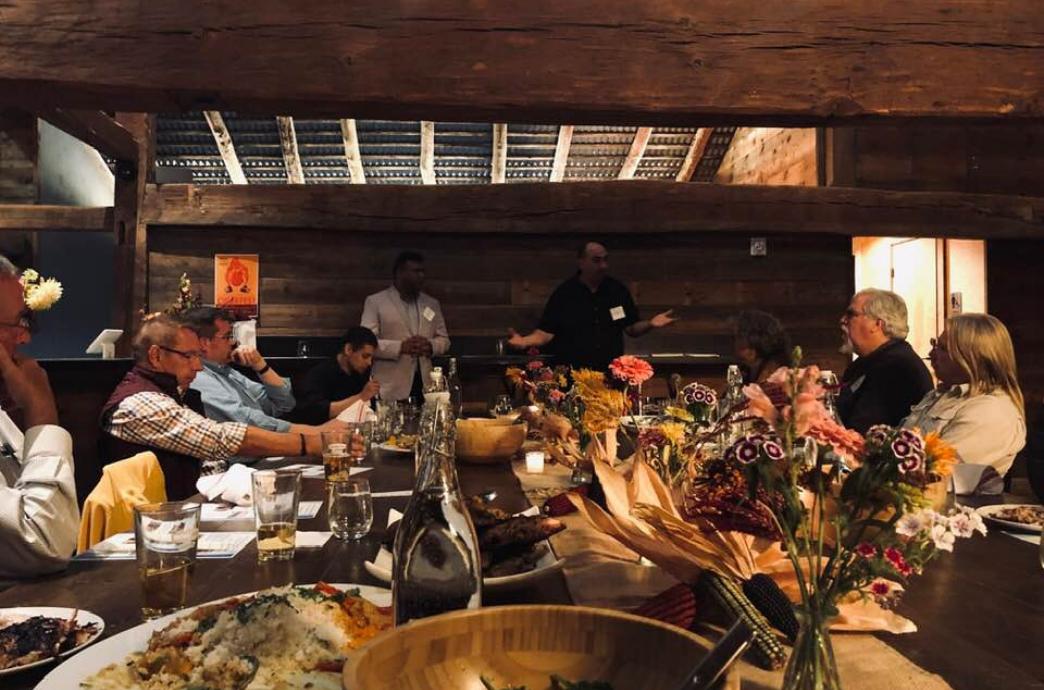 Alumni gather at Ironbound Farm to discuss sustainable business practices in 2019.