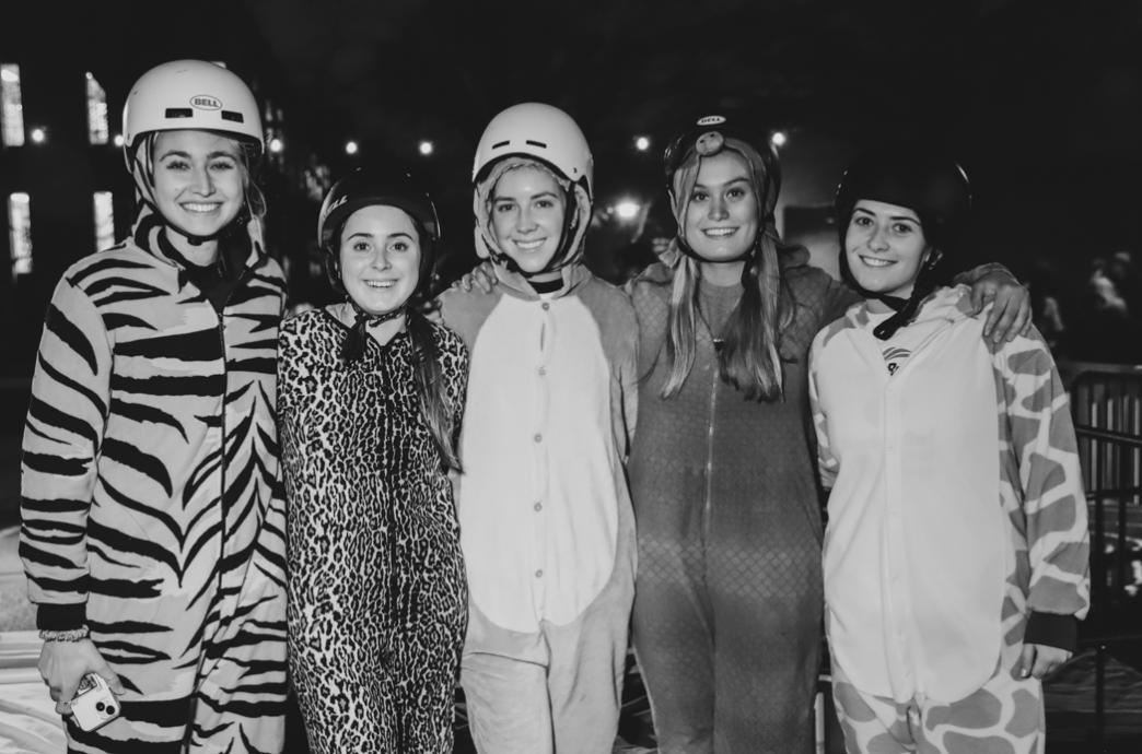 Students dressed for the races in animal onesies