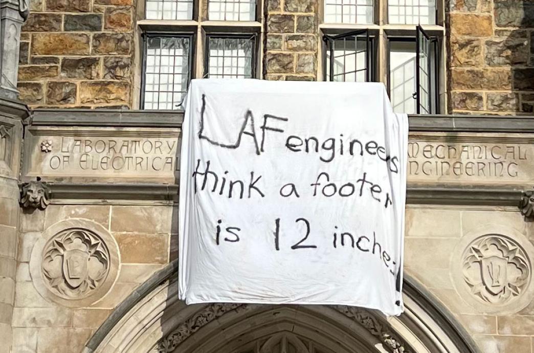 Le-Laf Bedsheet reading "Laf engineers think a footer is 12 inches"