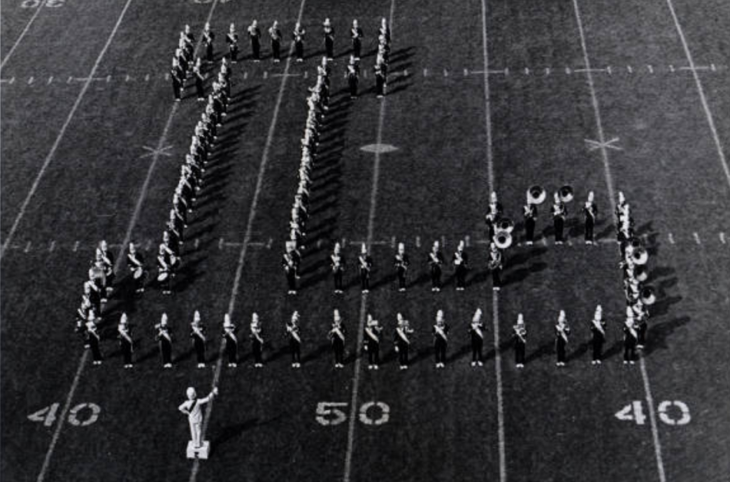Players and students forming an L on the field