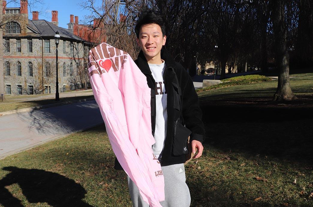 Student holds up shirt
