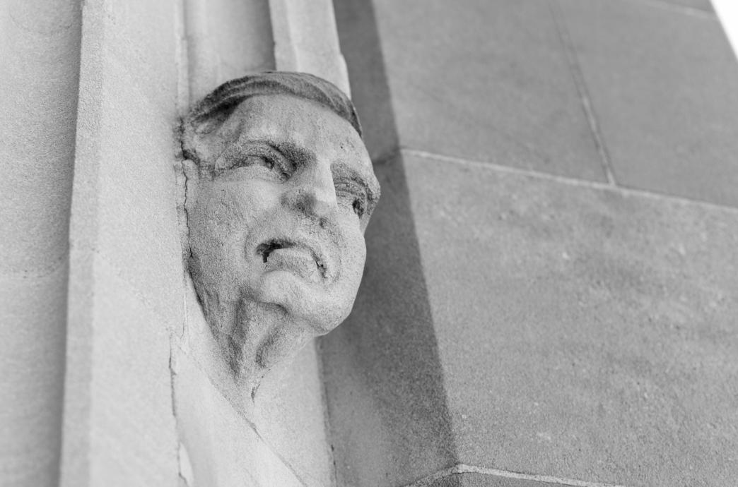 Statue of a face on exterior of Linderman Library