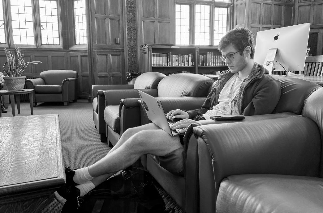 A man relaxing in Linderman Library