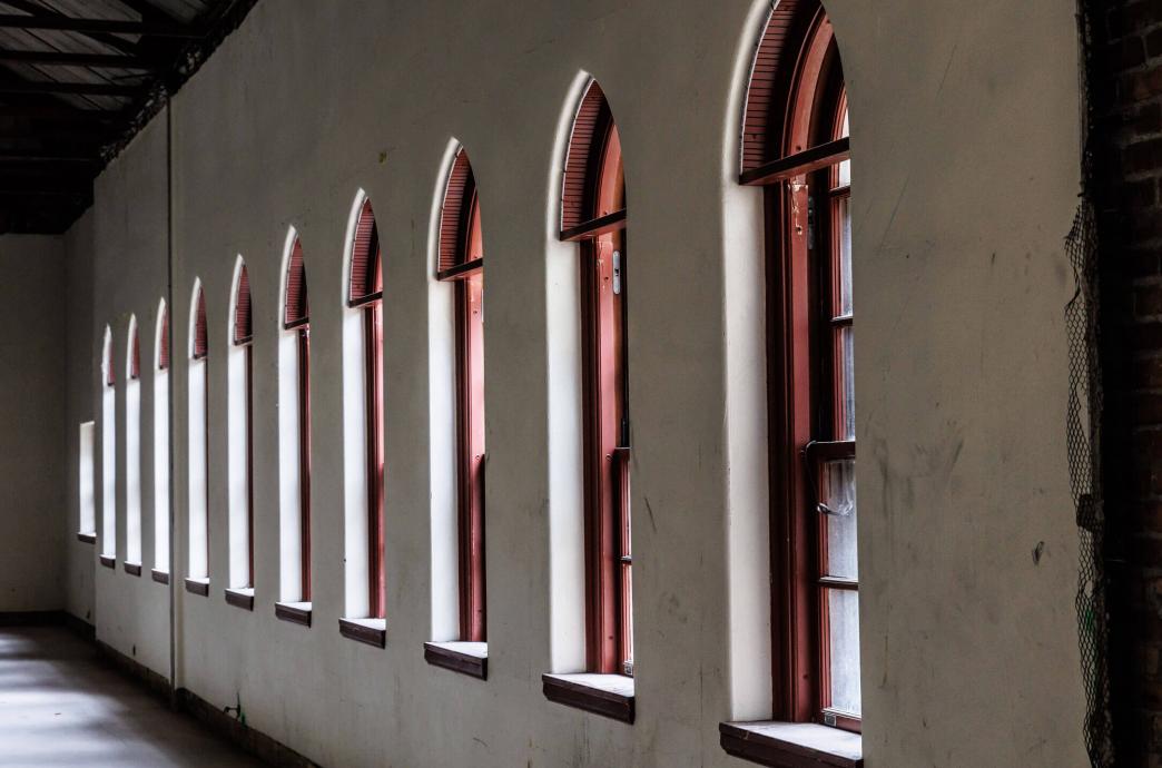 Arched windows with red painted frames