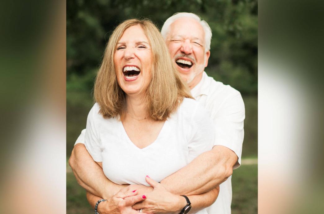 Mark and Susan Hembarsky laughing and holding each other