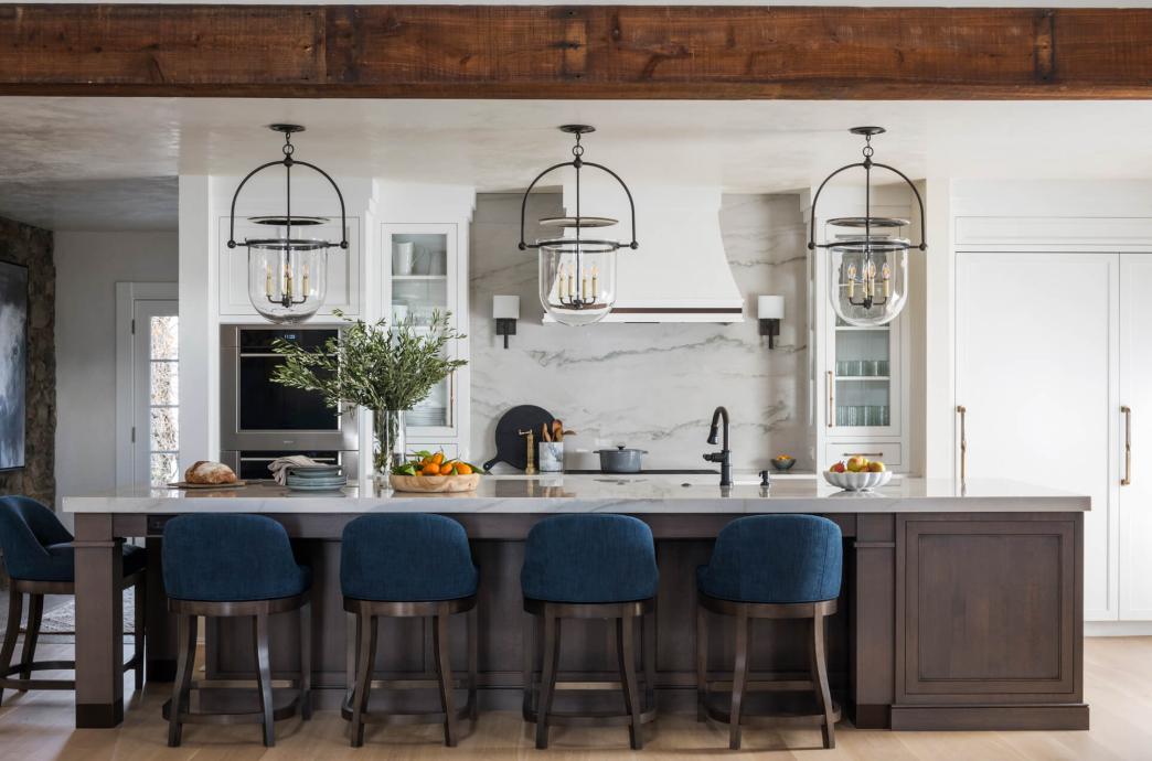 A kitchen island with four barstools