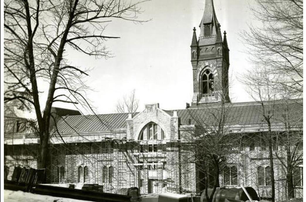 A black and white photo from 1955 shows scaffolding assembled on the University Center.