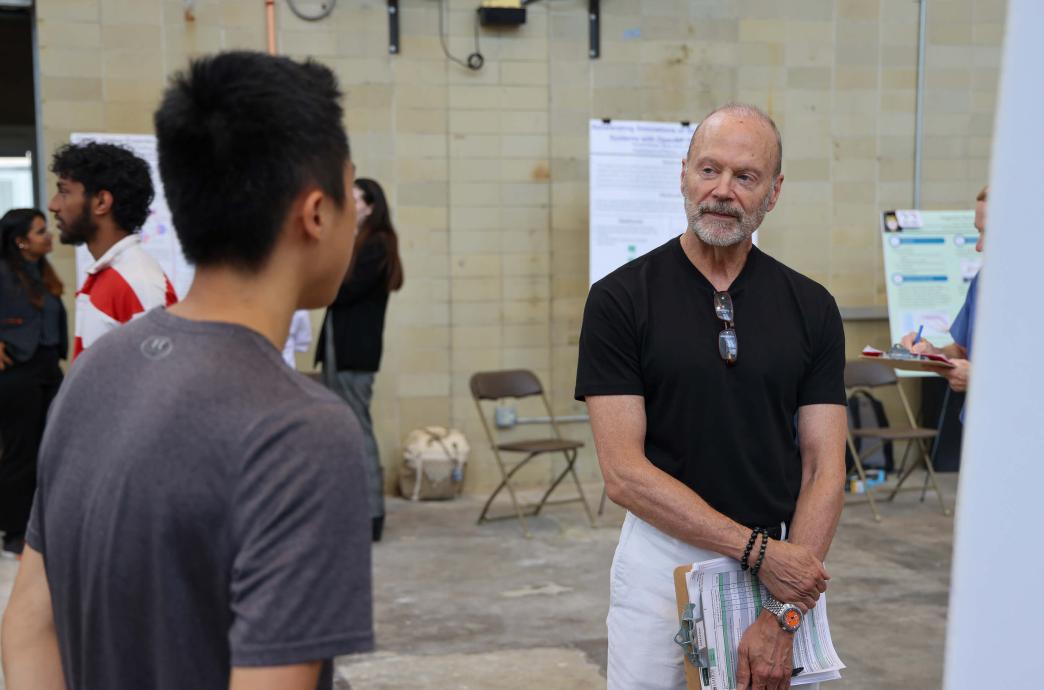 Clement Palevich ’83 ’25P attends the 2024 Research Expo as a judge for the event.