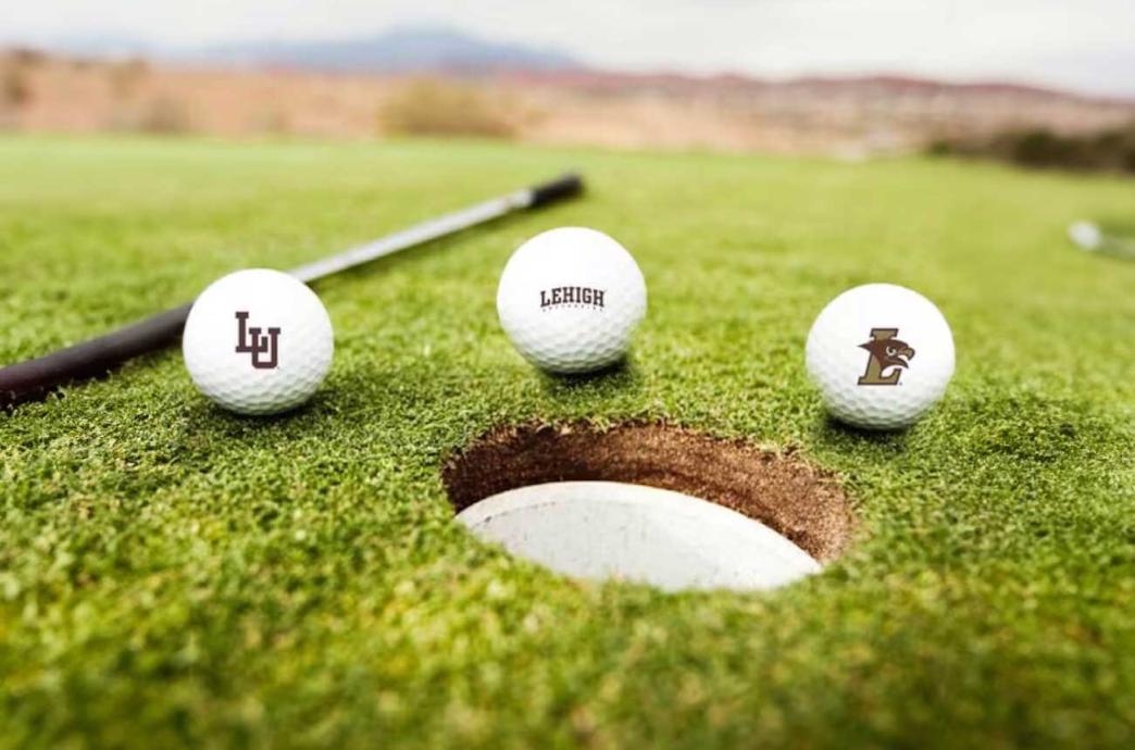 Three Lehigh branded gold bolls resting around the cup.