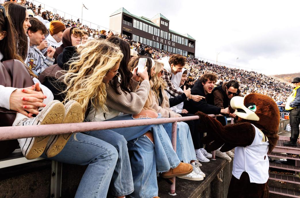 Fans in the bleachers of Goodman Stadium admiring Clutch as he visits the front row.