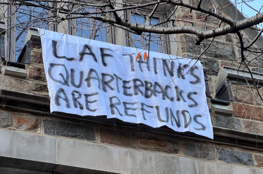Lehigh bed sheet reading "Laf thinks quarterbacks are refunds."