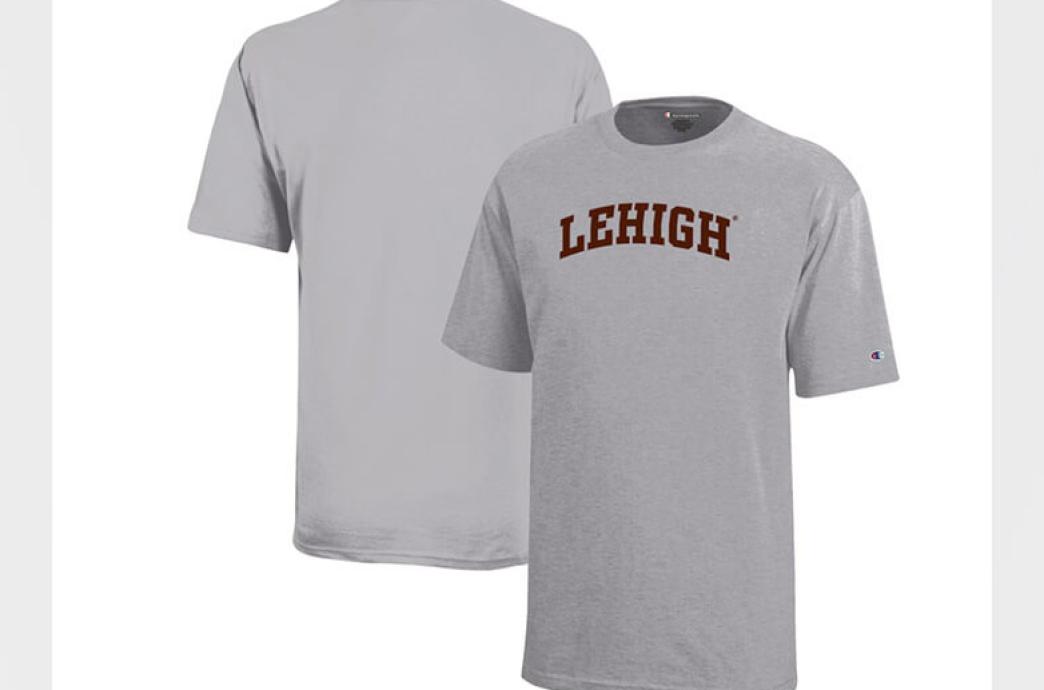 A product image of a light gray tshirt with a small Champion logo on the sleeve and “Lehigh” spelled on the front in brown.