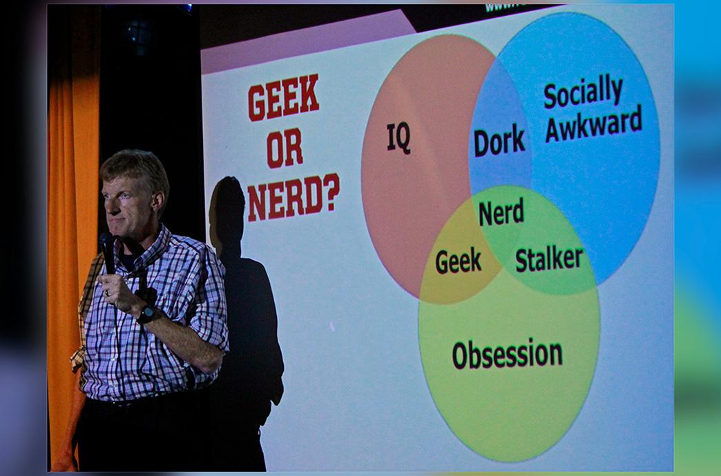 Don McMillan stands on stage using a Venn diagram to explain what a nerd is