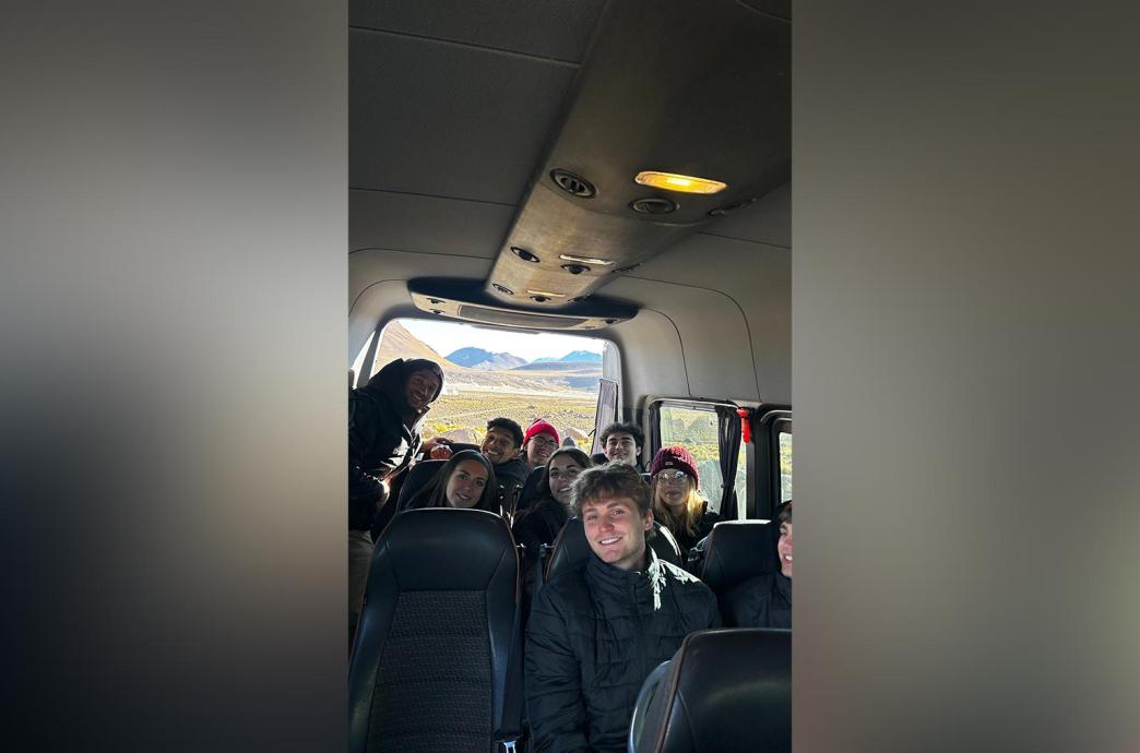 A group of students in a car together traveling around the Atacama Desert.