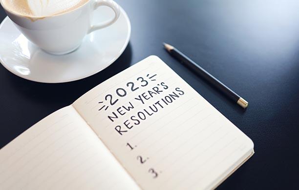 Notebook is open to page with title 2023 New Year Resolutions