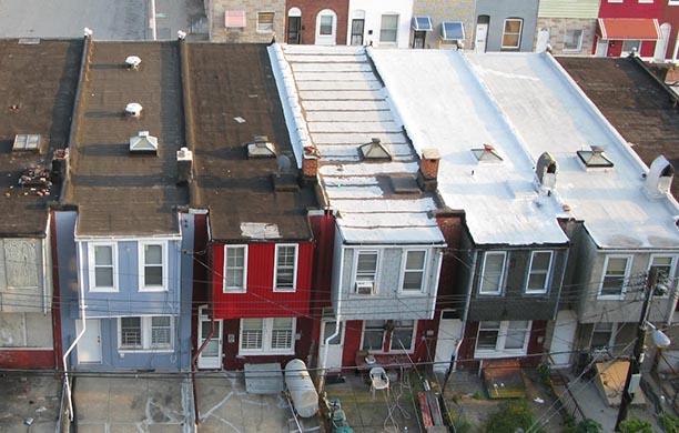 White painted roofs on row houses